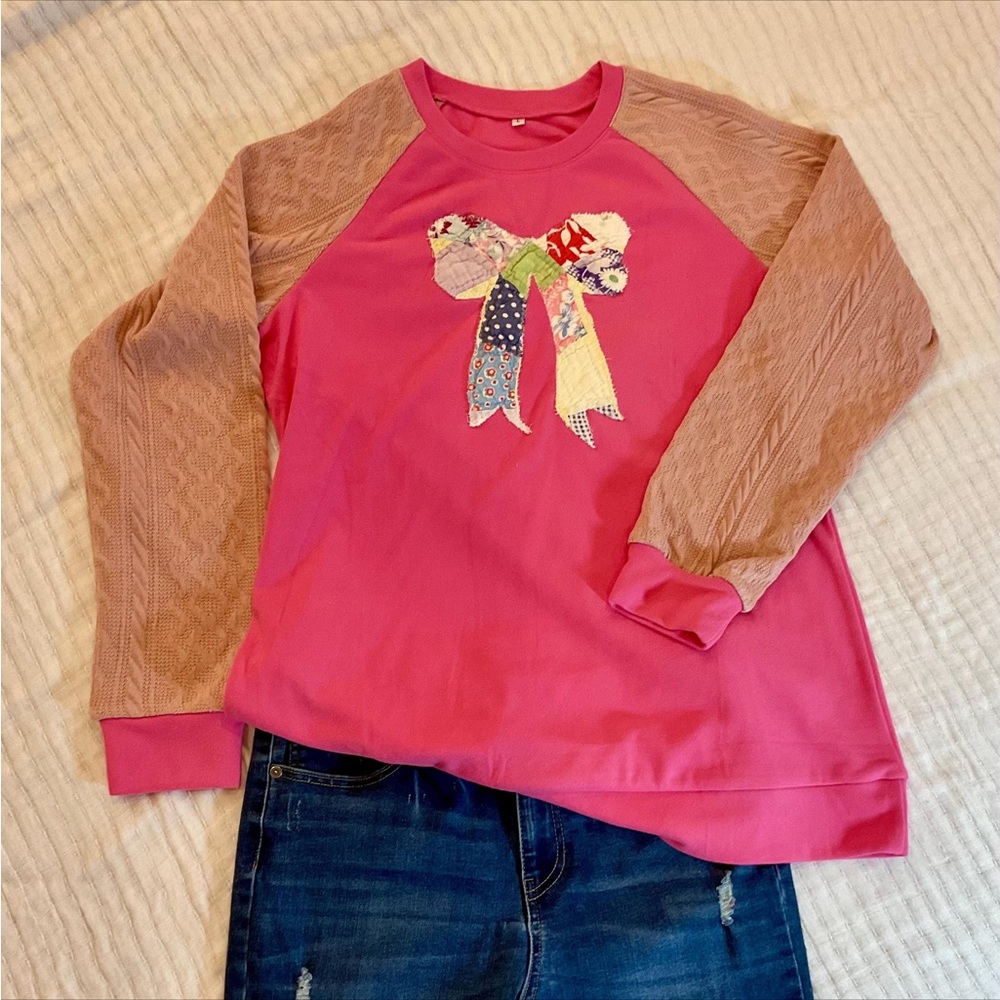 Pink sweatshirt with vintage quilt Bow Design and cable knit sweater sleeves